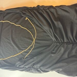 Elegant Black Dress with Gold Chain Detail